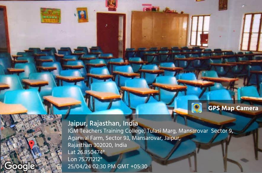 A classroom with blue chairs with writing tablets