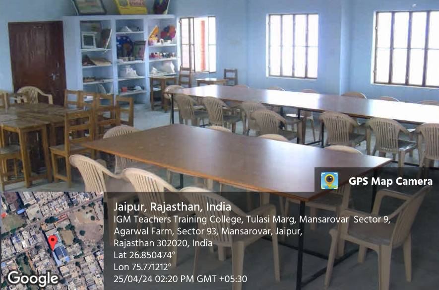 A room set out with tables and chairs for group work