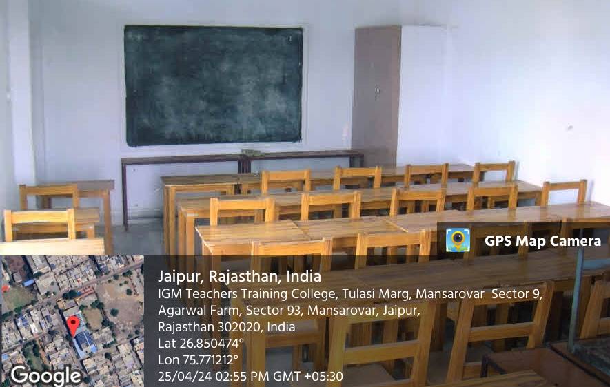 A classroom with wooden desks and a blackboard