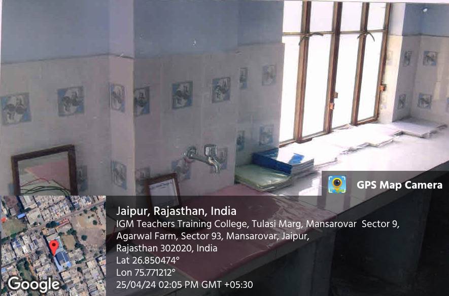 A room with tiled walls and a wash basin